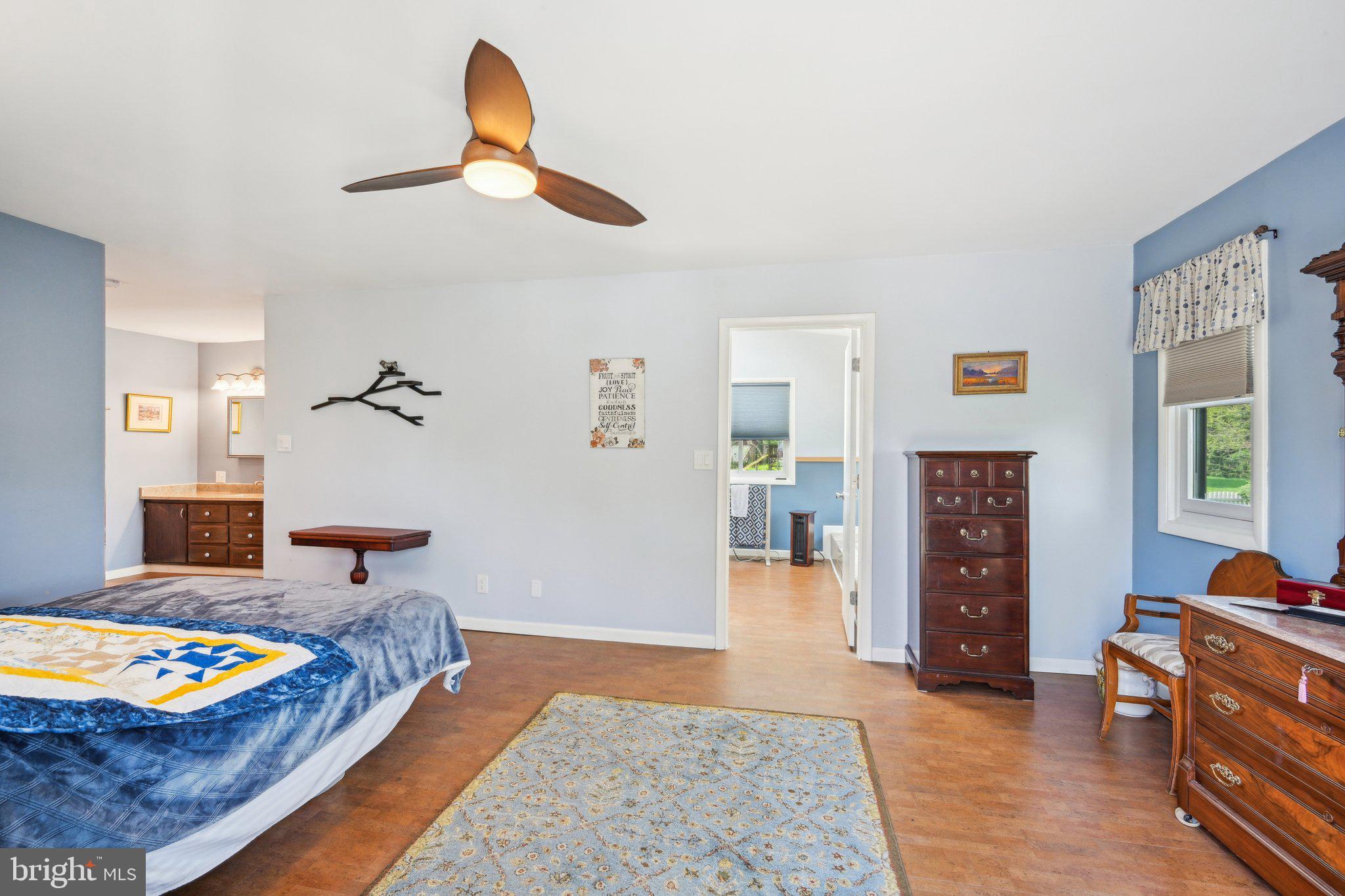 205 Lehigh Road South Glassboro, NJ 08028 - Photo 27 of 51 a bedroom with a bed and wooden floor