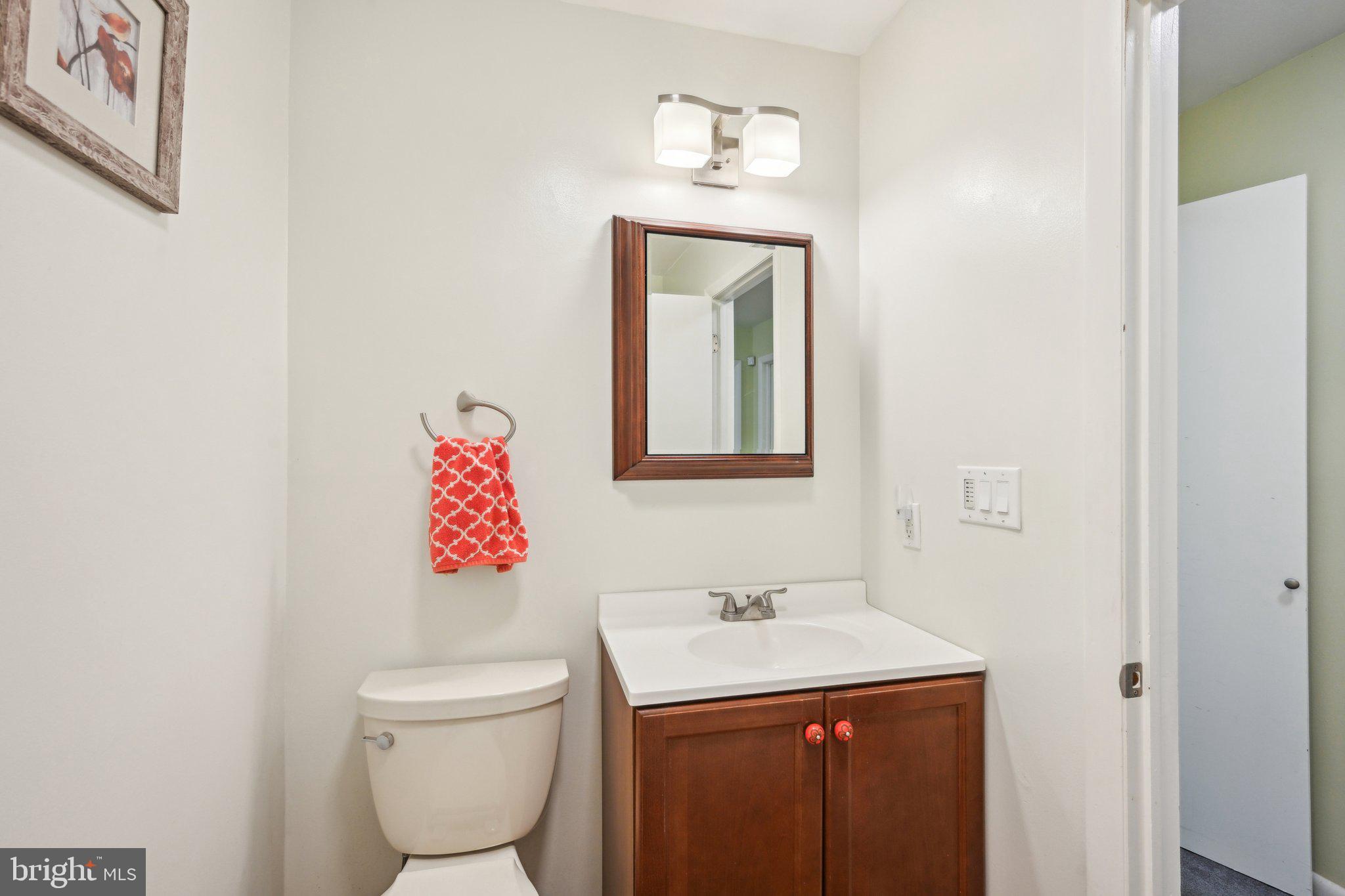 205 Lehigh Road South Glassboro, NJ 08028 - Photo 35 of 51 a bathroom with a toilet sink and mirror