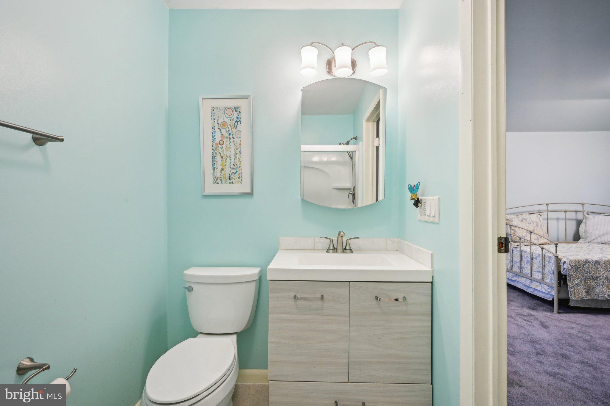 205 Lehigh Road South Glassboro, NJ 08028 - Photo 40 of 51 a bathroom with a toilet sink and mirror