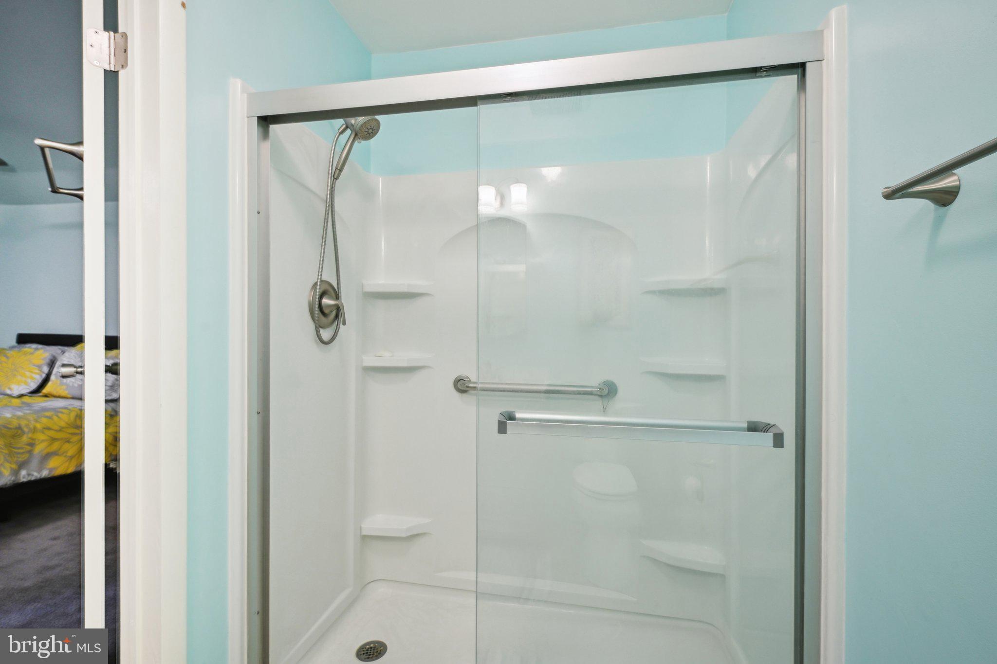 205 Lehigh Road South Glassboro, NJ 08028 - Photo 41 of 51 a bathroom with a glass shower door