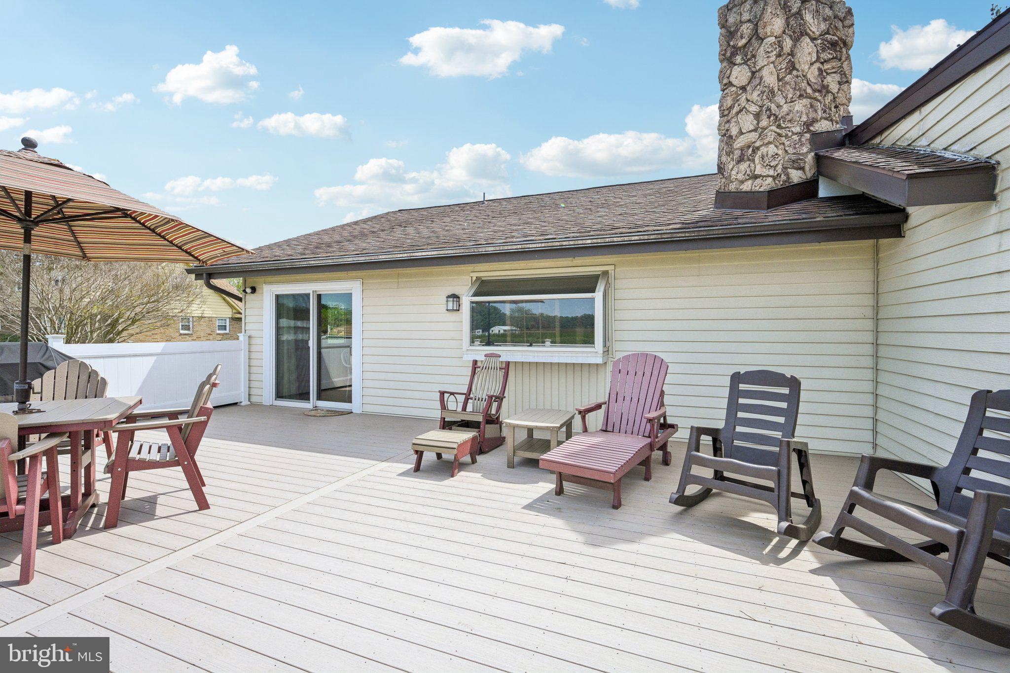 205 Lehigh Road South Glassboro, NJ 08028 - Photo 45 of 51 a view of a roof deck with chair and tables