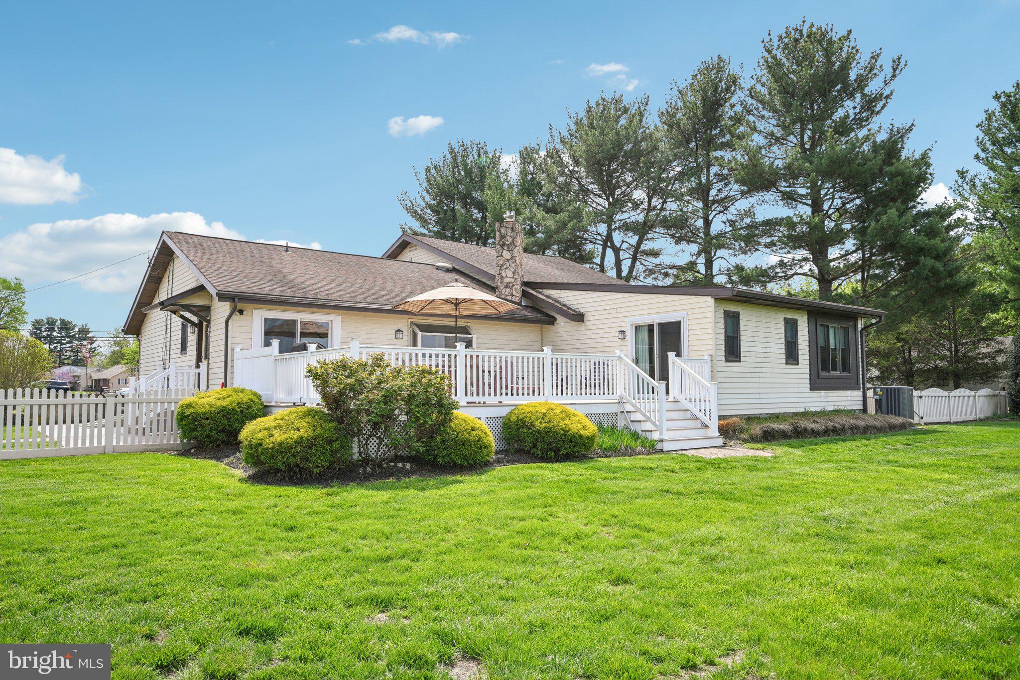 205 Lehigh Road South Glassboro, NJ 08028 - Photo 46 of 51 a front view of a house with a garden and yard