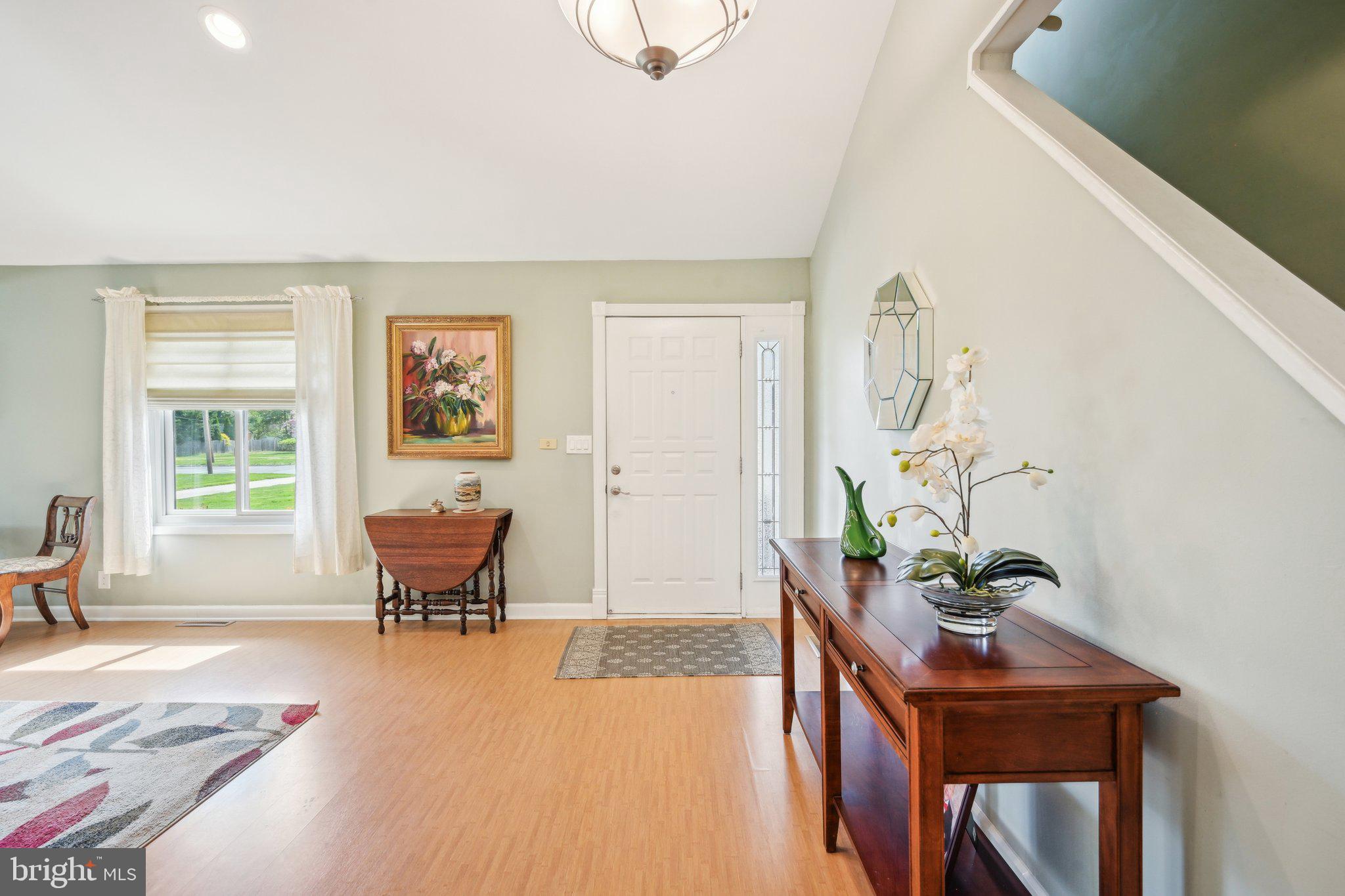 205 Lehigh Road South Glassboro, NJ 08028 - Photo 10 of 51 a living room with furniture and a potted plant