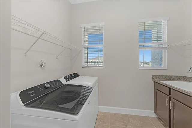a utility room with dryer and washer