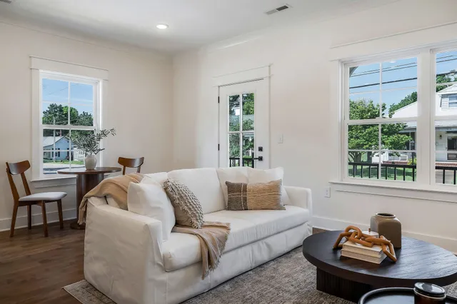 a living room with furniture and window