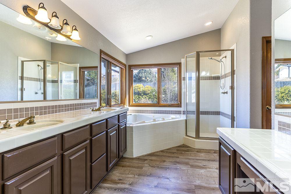 725 Arius Court Reno, NV 89512 - Photo 16 of 27 a large kitchen with a large window and stainless steel appliances