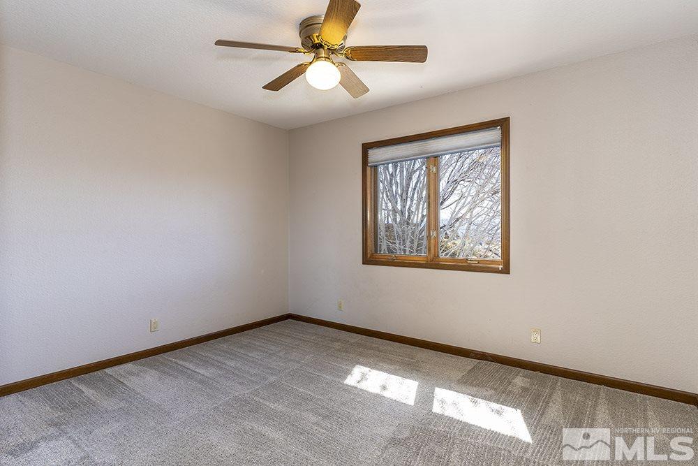 725 Arius Court Reno, NV 89512 - Photo 17 of 27 a view of an empty room with a window