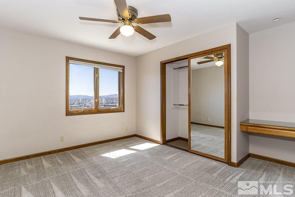 725 Arius Court Reno, NV 89512 - Photo 18 of 27 a view of empty room with window and ceiling fan
