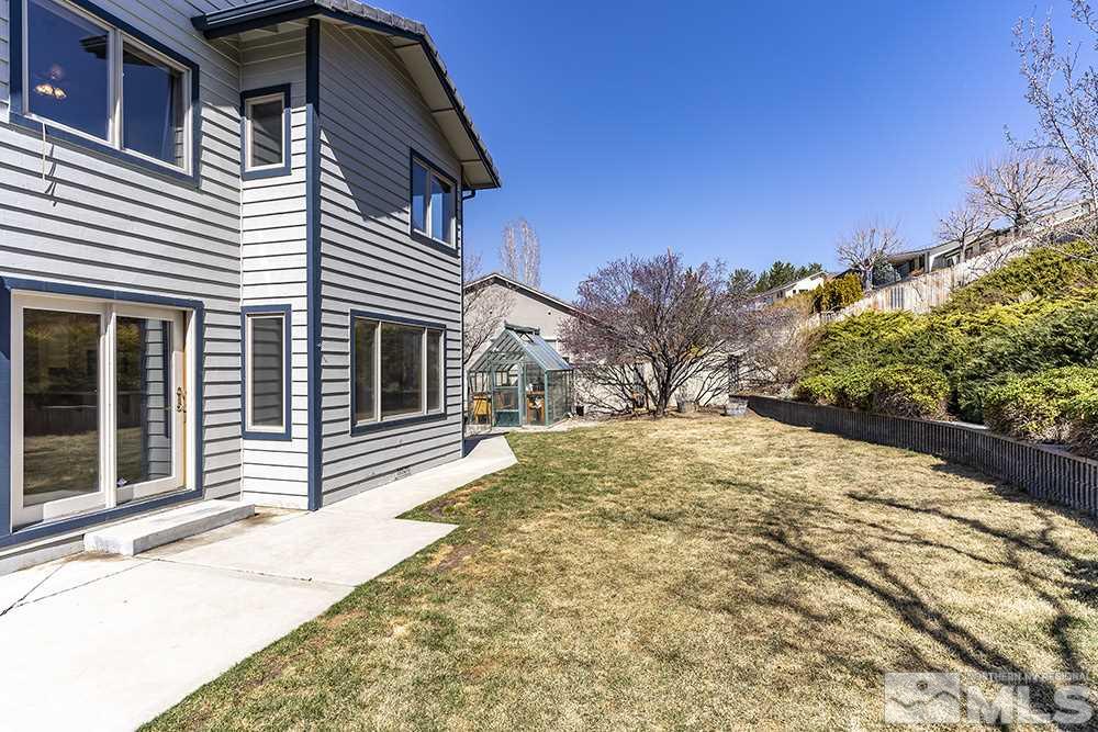 725 Arius Court Reno, NV 89512 - Photo 23 of 27 a view of a house with a yard