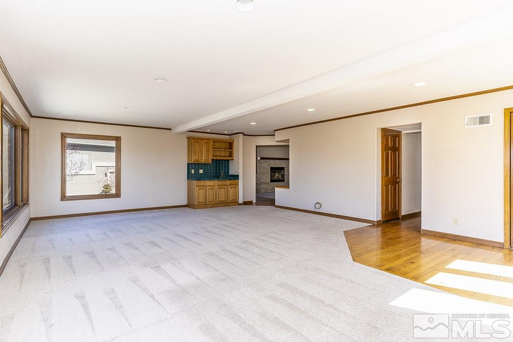 725 Arius Court Reno, NV 89512 - Photo 4 of 27 a view of empty room with wooden floor
