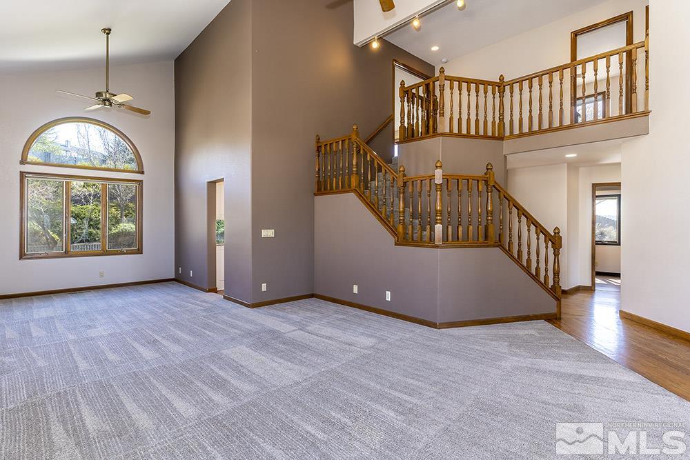 725 Arius Court Reno, NV 89512 - Photo 6 of 27 an empty room with windows and stairs