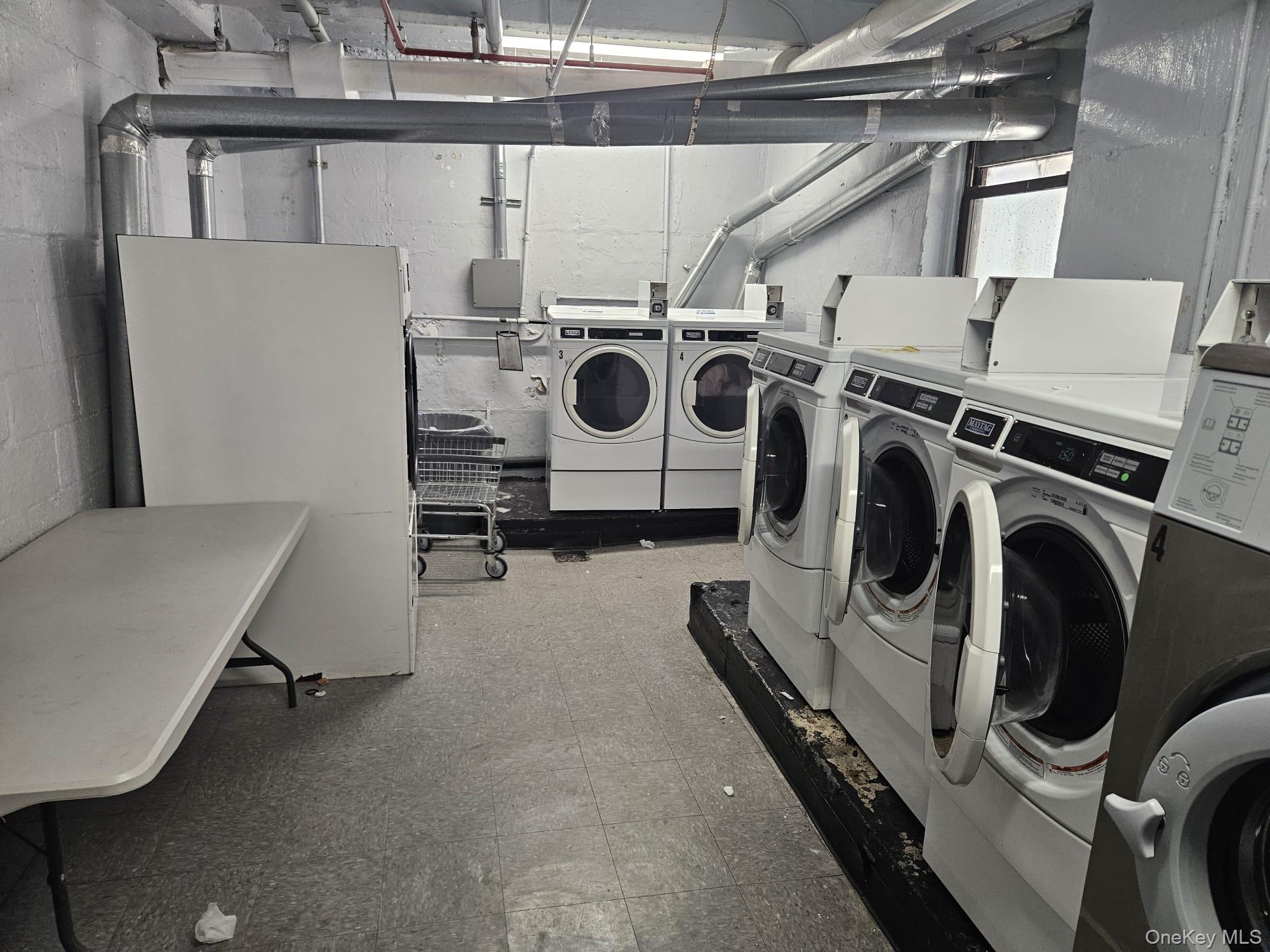 102-18 64th Avenue, Unit 2X Queens, NY 11375 - Photo 16 of 17 a utility room with dryer and washer