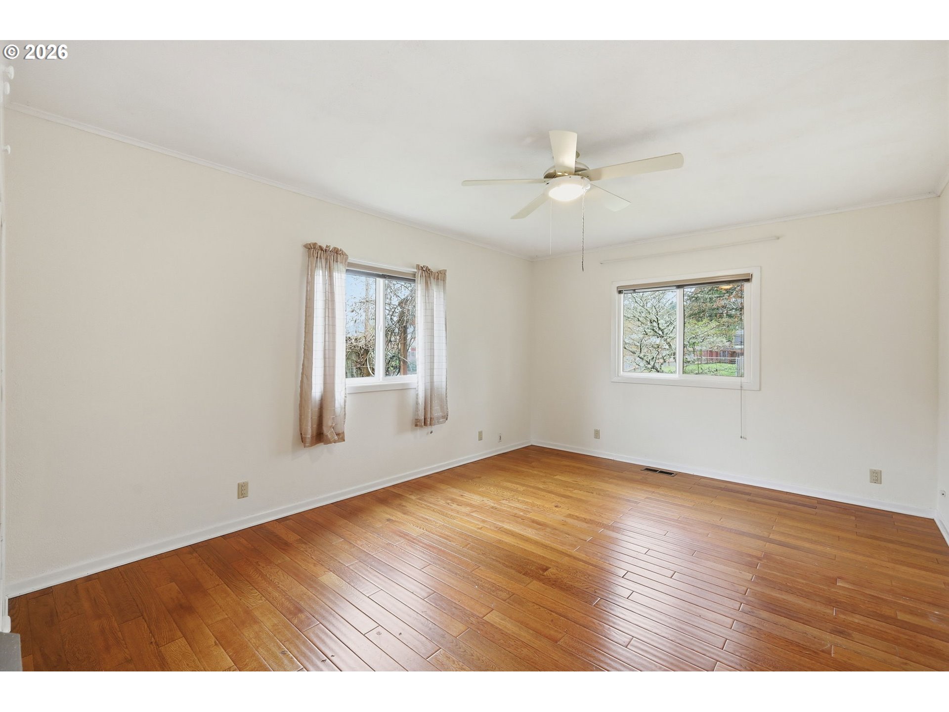 710 South 1st Street Cottage Grove, OR 97424 - Photo 15 of 46 wooden floor in an empty room with a window