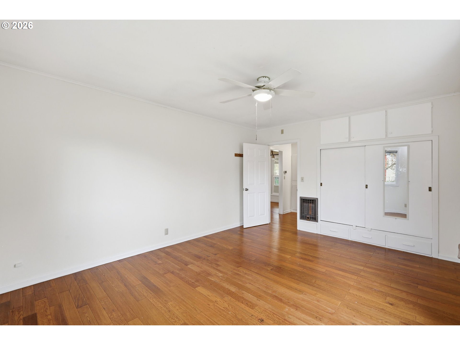 710 South 1st Street Cottage Grove, OR 97424 - Photo 17 of 46 a view of an empty room with wooden floor