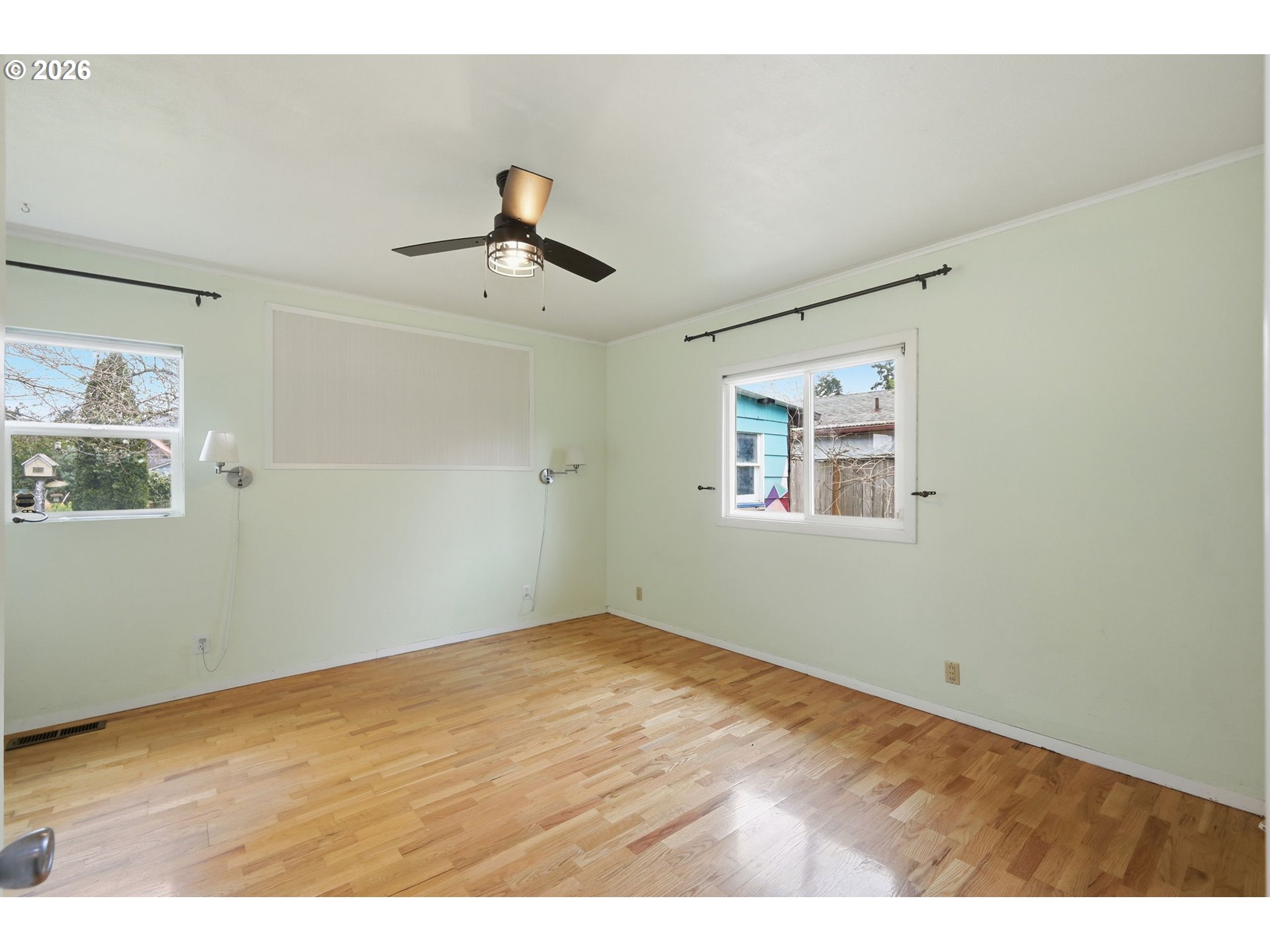 710 South 1st Street Cottage Grove, OR 97424 - Photo 18 of 46 a view of empty room with wooden floor