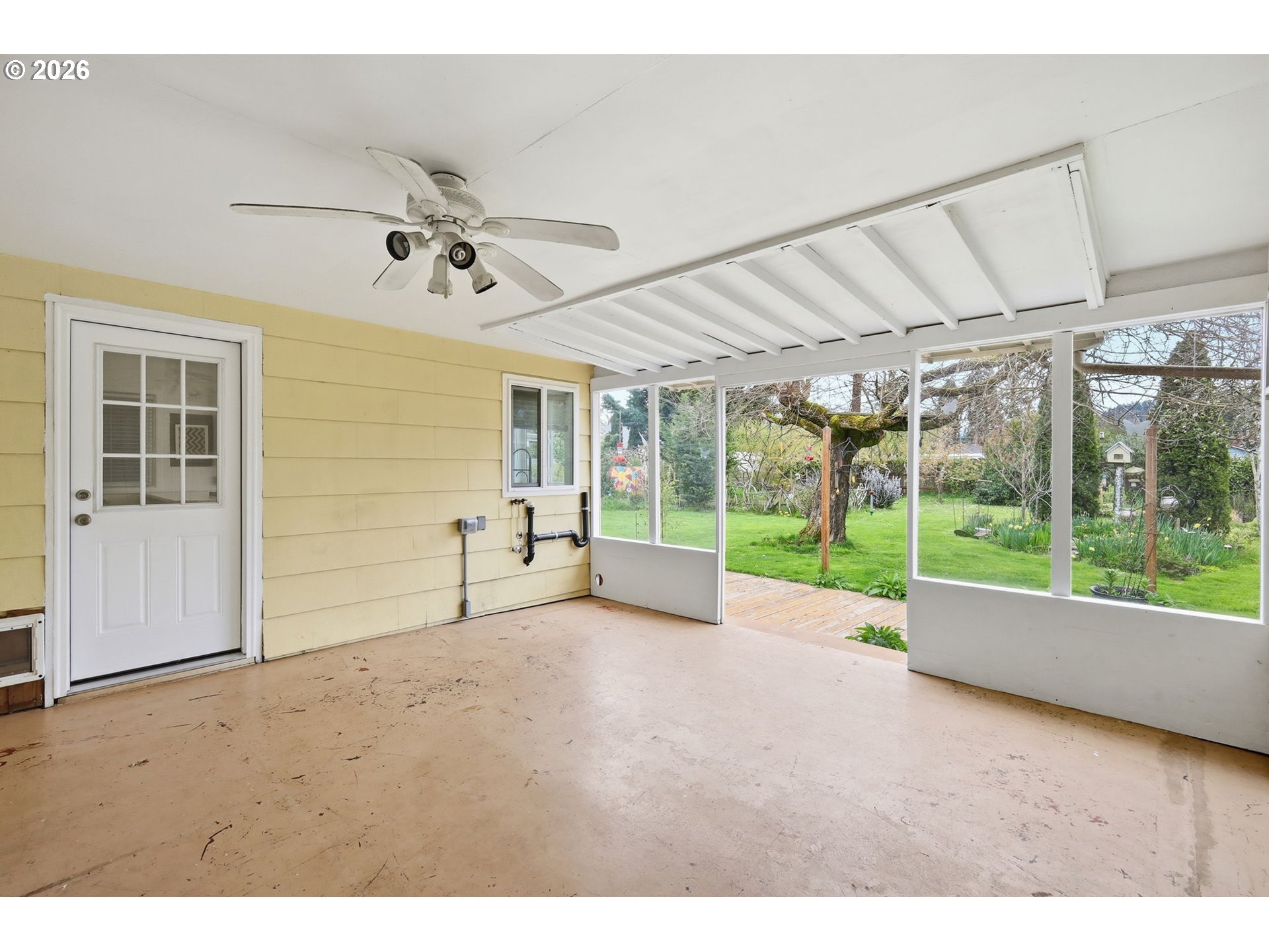 710 South 1st Street Cottage Grove, OR 97424 - Photo 33 of 46 a view of an empty room with floor to ceiling windows