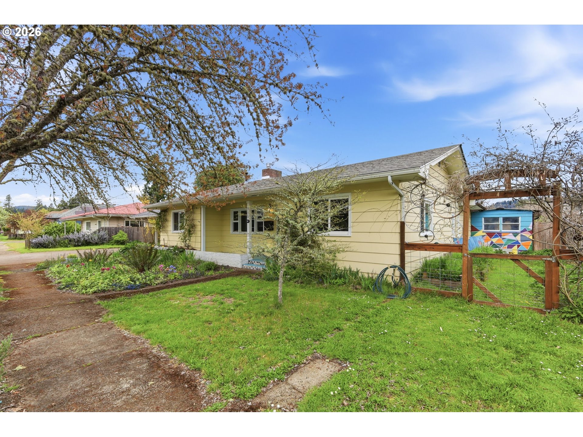 710 South 1st Street Cottage Grove, OR 97424 - Photo 45 of 46 a view of a house with a yard