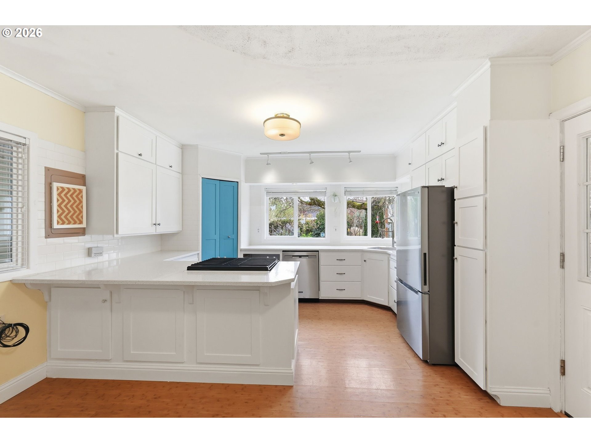 710 South 1st Street Cottage Grove, OR 97424 - Photo 8 of 46 a living room with stainless steel appliances kitchen island granite countertop a refrigerator and a sink