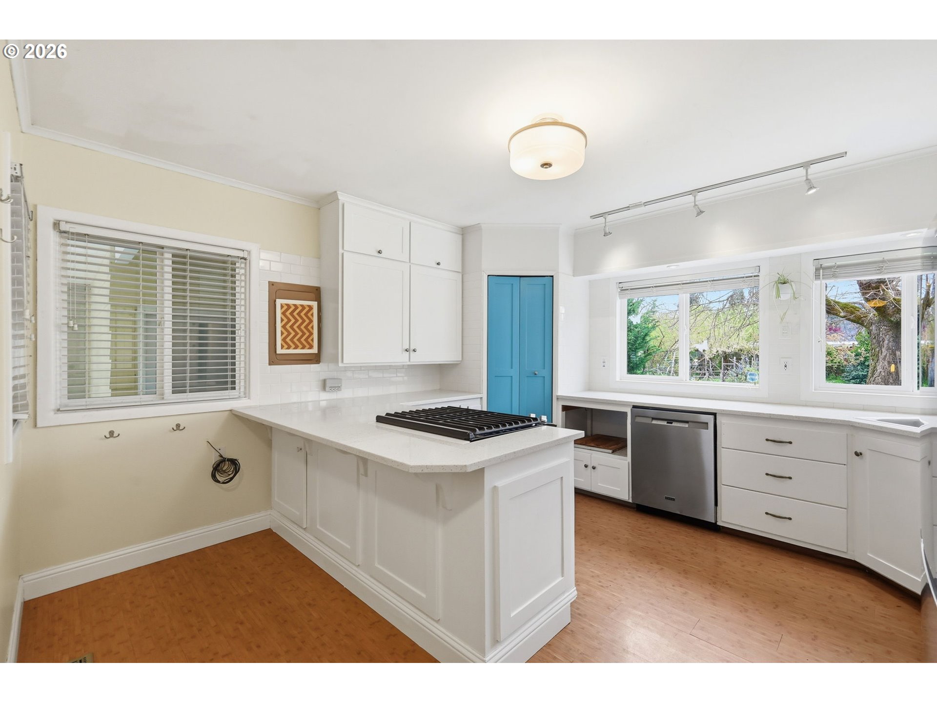 710 South 1st Street Cottage Grove, OR 97424 - Photo 9 of 46 a kitchen with granite countertop white cabinets and white appliances