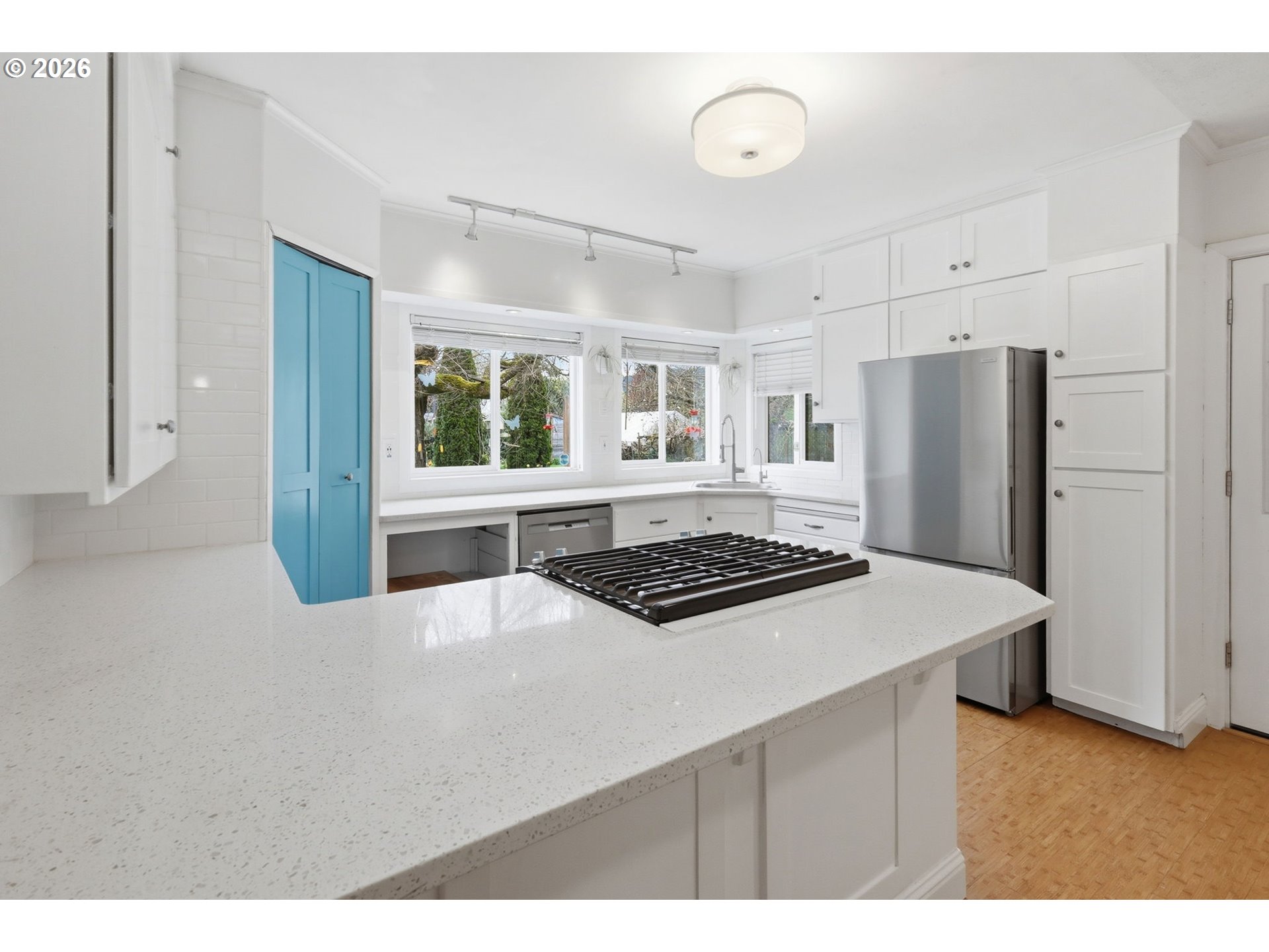 710 South 1st Street Cottage Grove, OR 97424 - Photo 10 of 46 a kitchen with stainless steel appliances a stove a refrigerator and a refrigerator with white cabinets