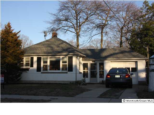1214 Dorsett Dock Road Point Pleasant, NJ 08742 - Photo 1 of 3 a front view of a house with a yard