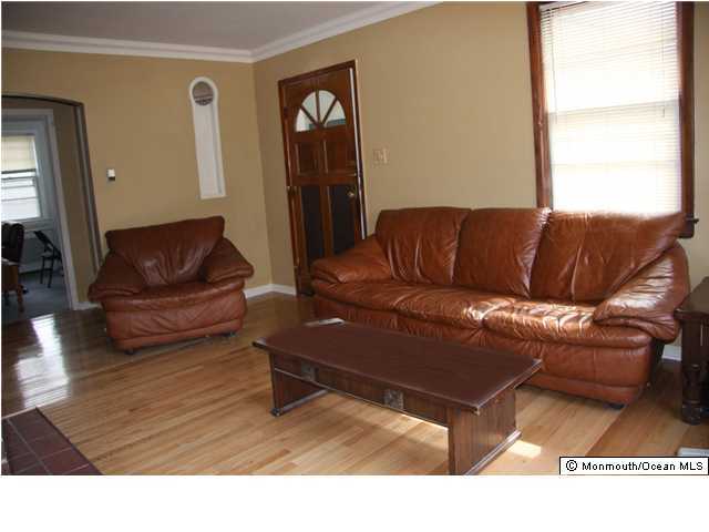 1214 Dorsett Dock Road Point Pleasant, NJ 08742 - Photo 2 of 3 a living room with furniture and a window