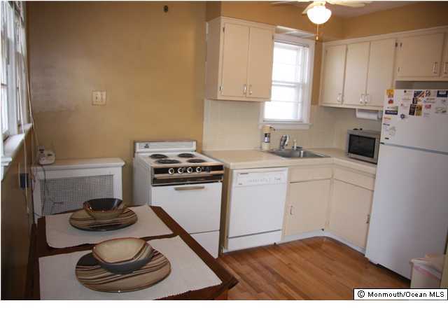 1214 Dorsett Dock Road Point Pleasant, NJ 08742 - Photo 3 of 3 a kitchen with a stove and a refrigerator