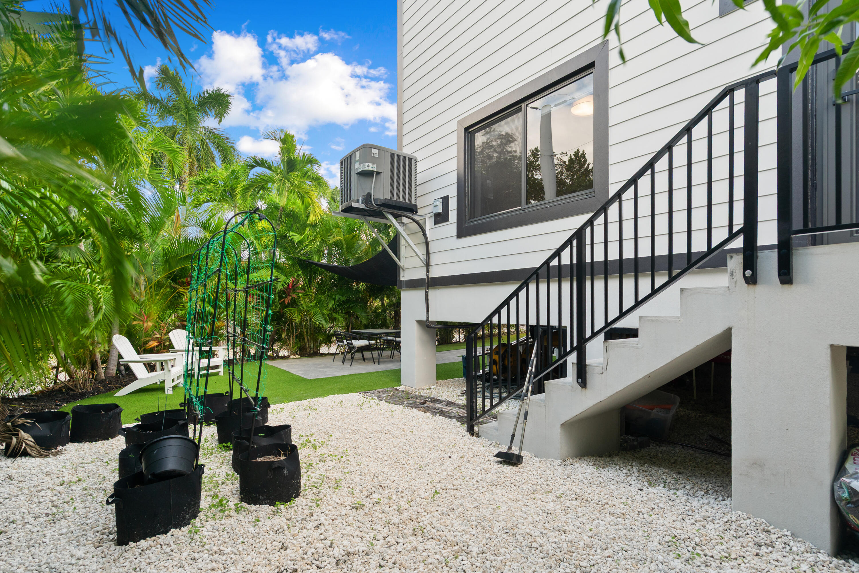 13 Coral Way Key Largo, FL 33037 - Photo 24 of 34 a view of stairs with wooden floor