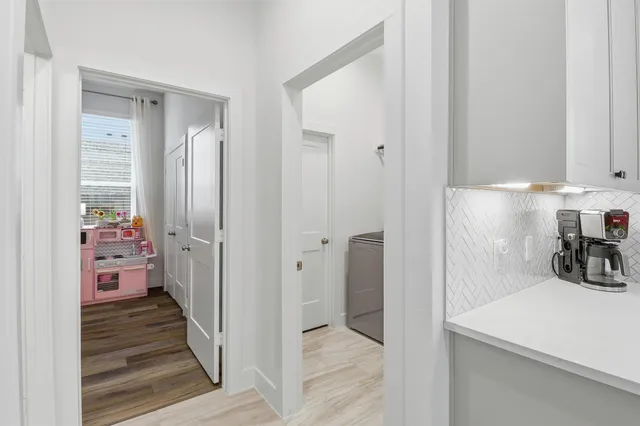 a view of storage and utility room with washer and dryer