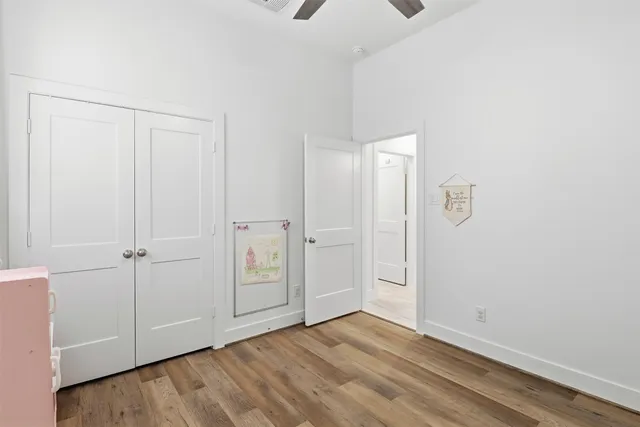 a bedroom with furniture and a book shelf