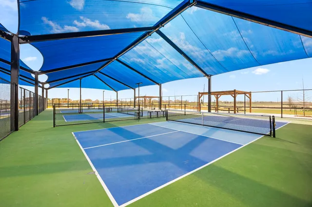 a front view of a house with a yard and porch