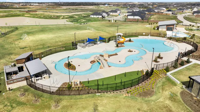 a view of a swimming pool with an ocean view