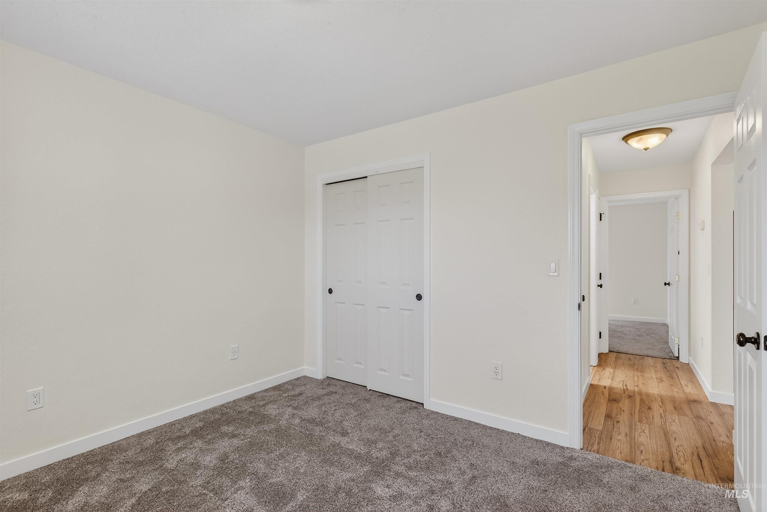 1519 17th Street Lewiston, ID 83501 - Photo 19 of 39 Unfurnished bedroom featuring light carpet and a closet