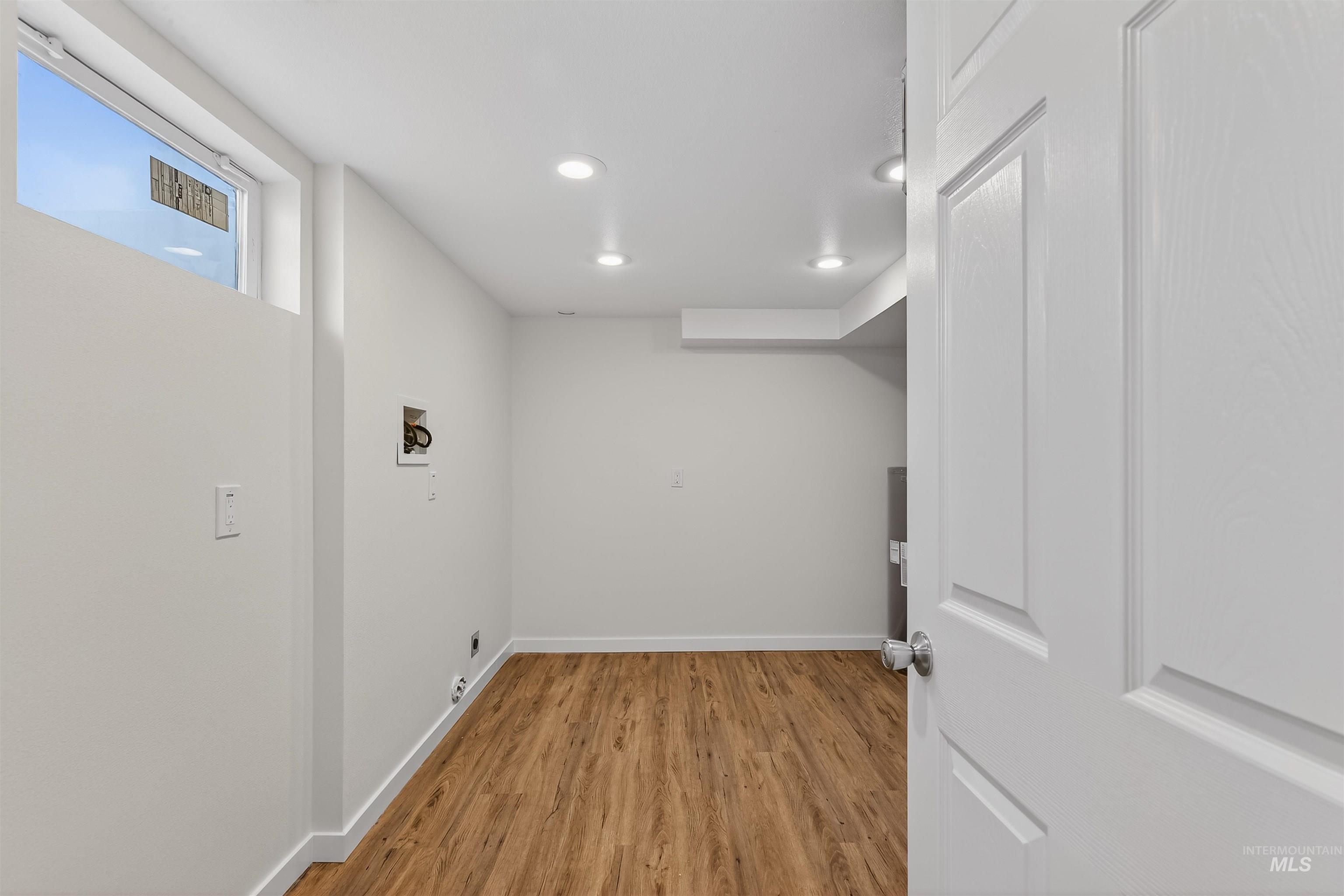 1519 17th Street Lewiston, ID 83501 - Photo 27 of 39 Laundry room featuring light wood finished floors, recessed lighting, and hookup for a washing machine