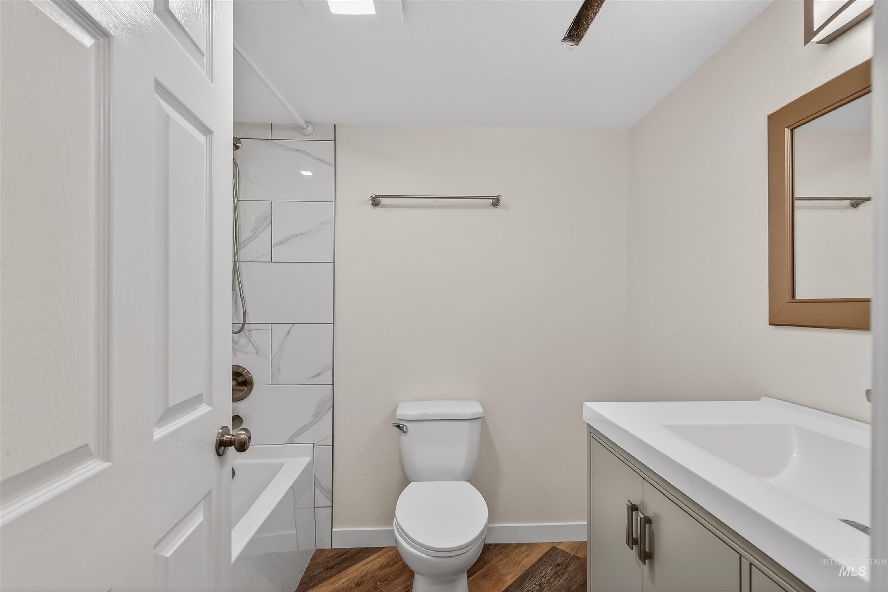 1519 17th Street Lewiston, ID 83501 - Photo 30 of 39 Bathroom with vanity, shower / tub combination, and dark wood-style floors