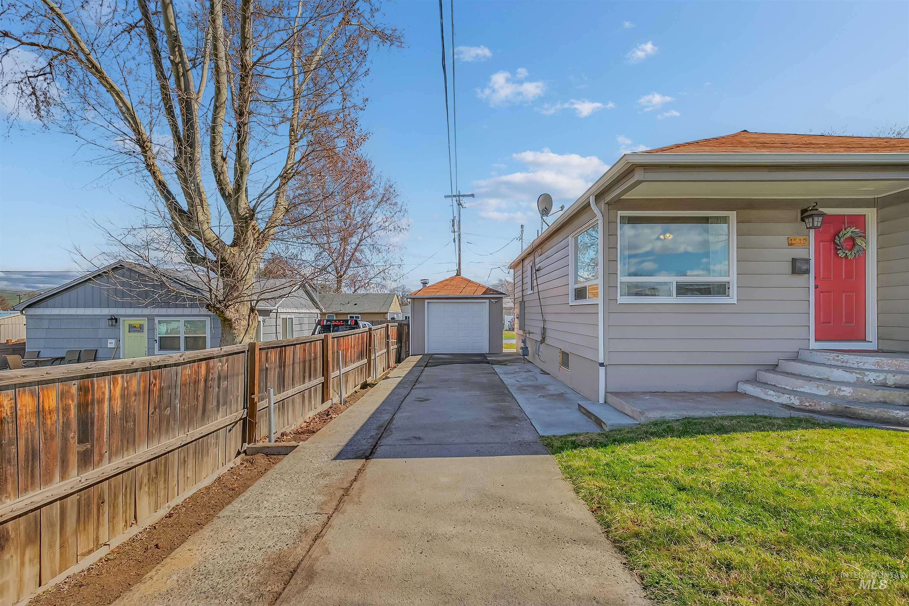 1519 17th Street Lewiston, ID 83501 - Photo 3 of 39 View of side of property with a garage, an outbuilding, driveway, and entry steps