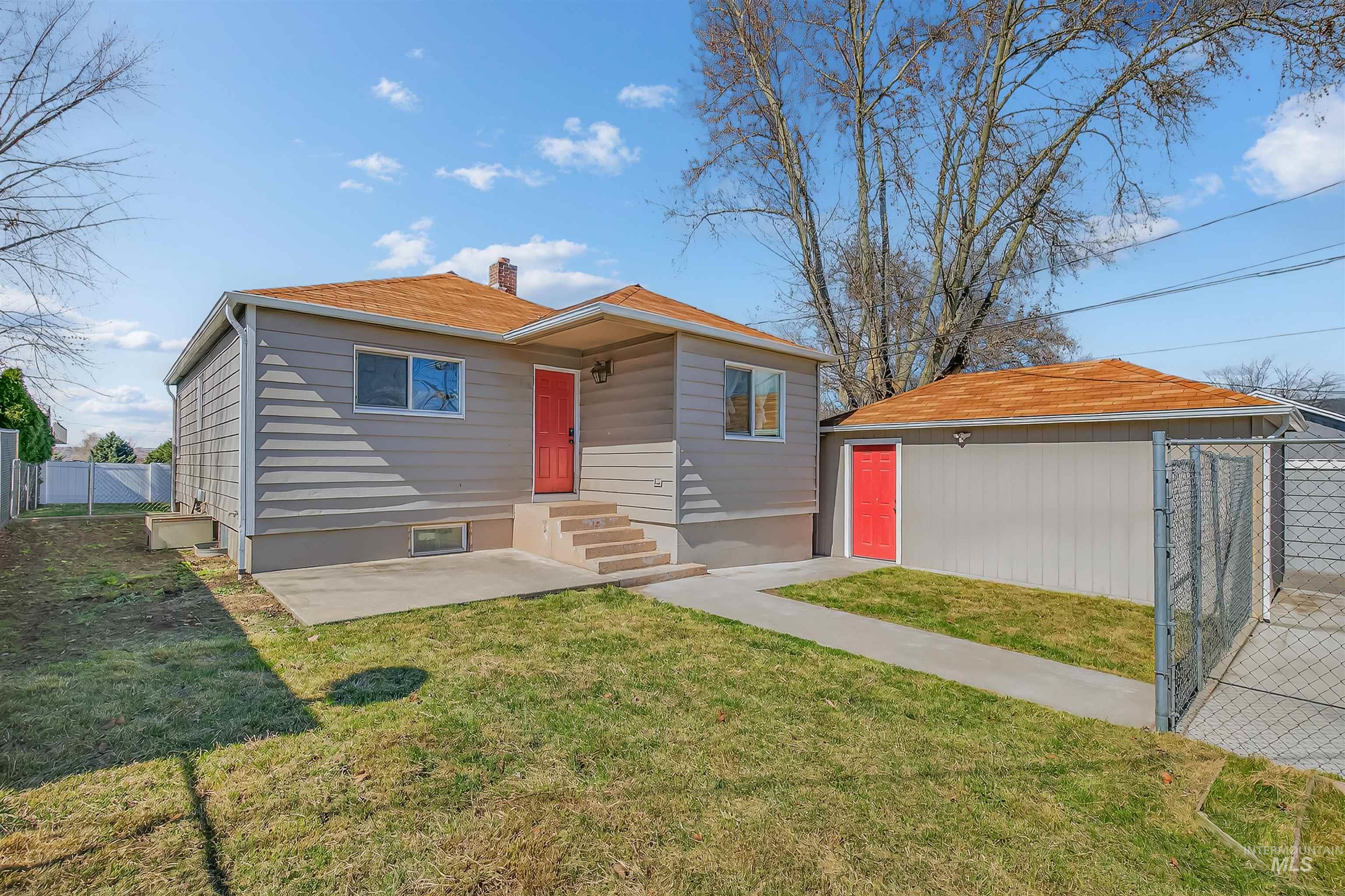 1519 17th Street Lewiston, ID 83501 - Photo 4 of 39 View of front of home featuring a gate, an outbuilding, and a chimney