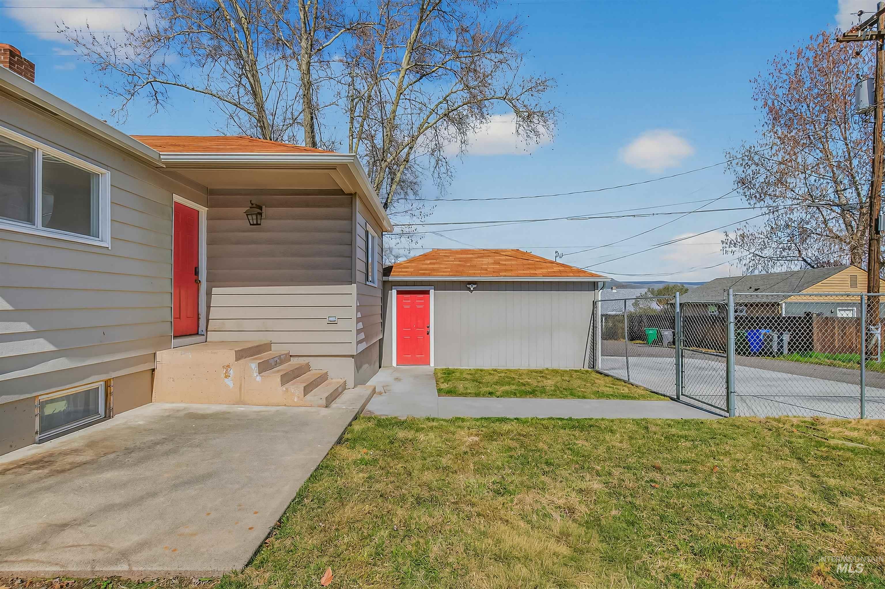 1519 17th Street Lewiston, ID 83501 - Photo 5 of 39 View of yard featuring a gate and an outdoor structure