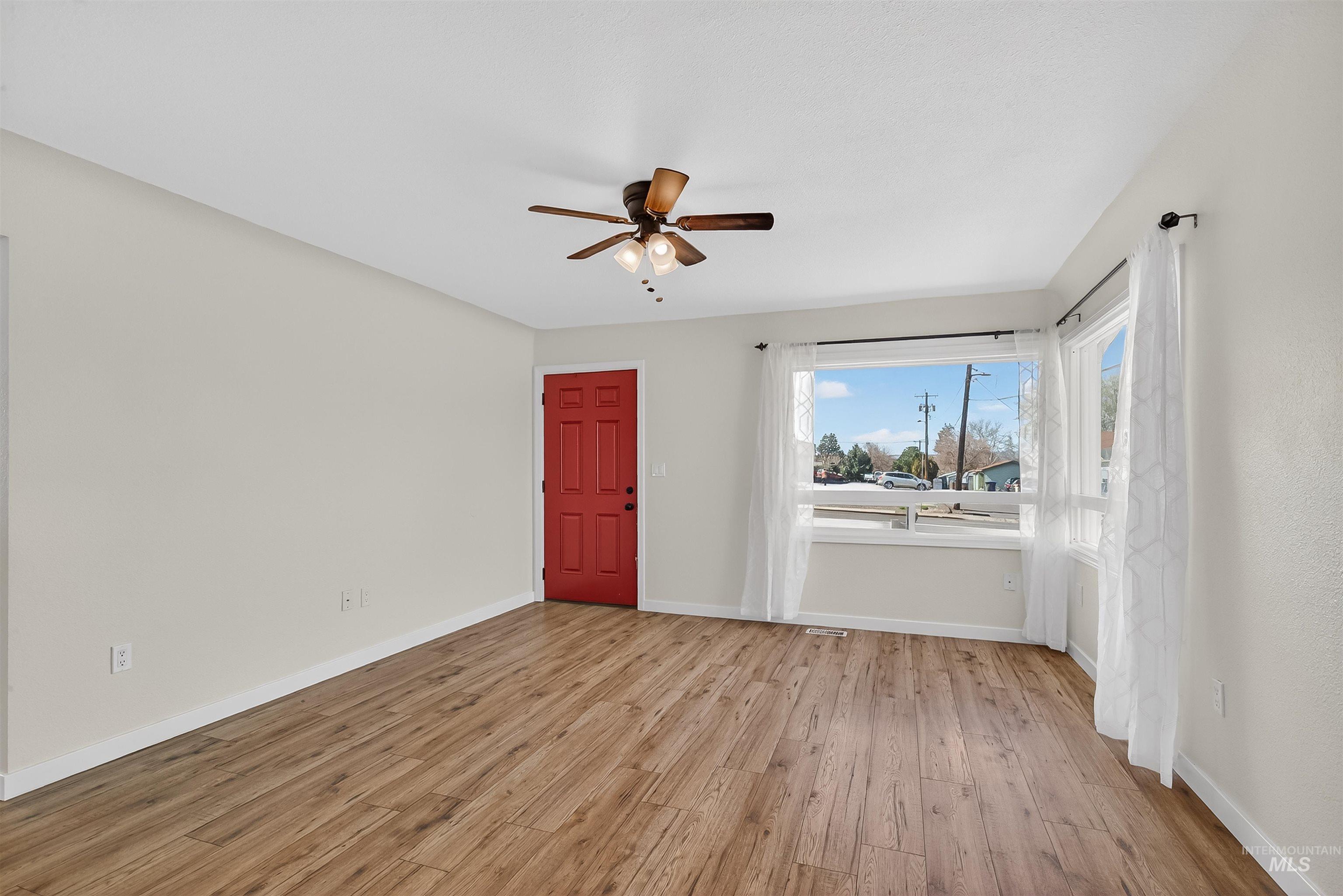 1519 17th Street Lewiston, ID 83501 - Photo 6 of 39 Spare room featuring light wood-type flooring and ceiling fan