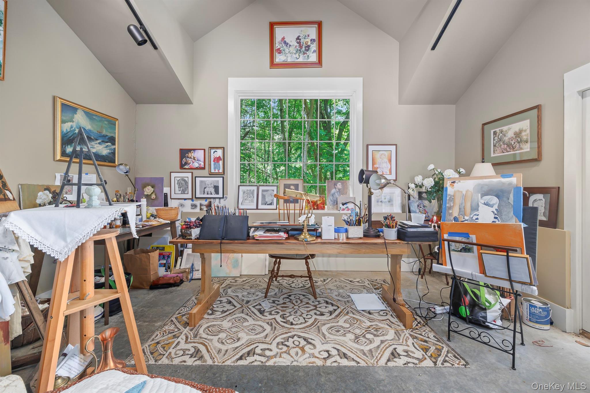 183 Titusville Road Poughkeepsie, NY 12603 - Photo 17 of 27 A wonderful art studio with very high ceiling has a private patio and glass sliding doors, offering great light