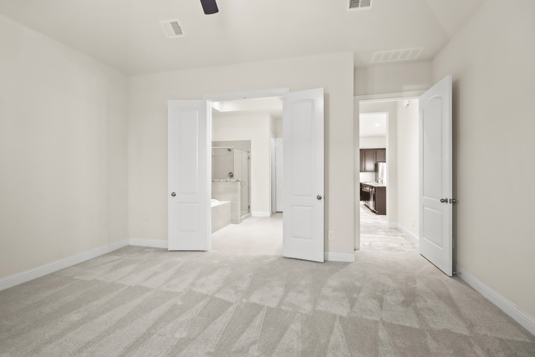 8931 Leaning Hollow Lane Spring, TX 77379 - Photo 13 of 38 The Primary Bedroom is located just off the kitchen/great room area towards the back of the home.