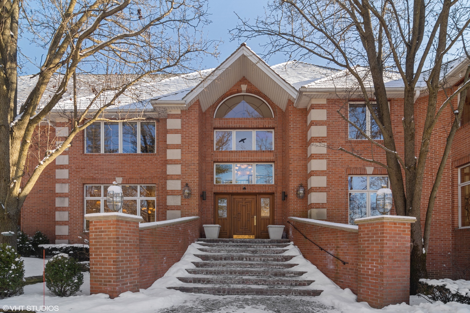 a front view of a house with large windows