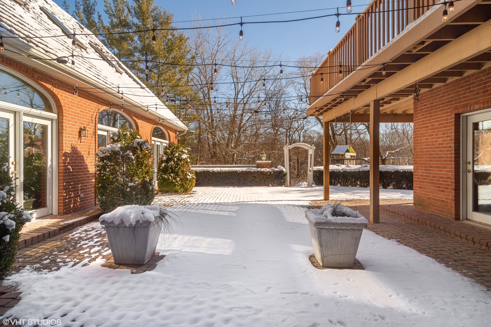 5852 Teal Lane Long Grove, IL 60047 - Photo 20 of 21 a view of a patio with table and chairs and iron fence
