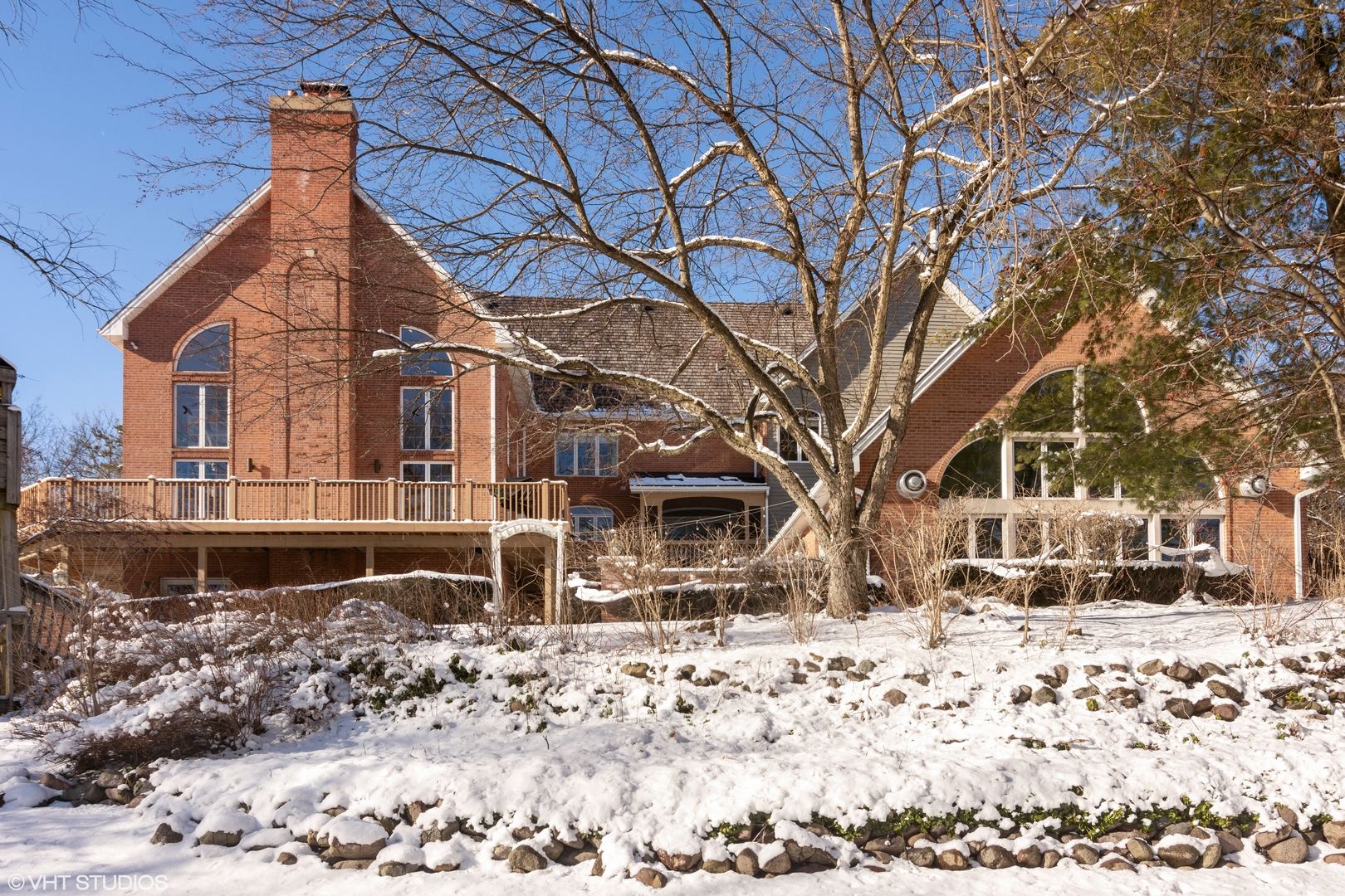 5852 Teal Lane Long Grove, IL 60047 - Photo 21 of 21 a backyard of a house with a yard covered in snow