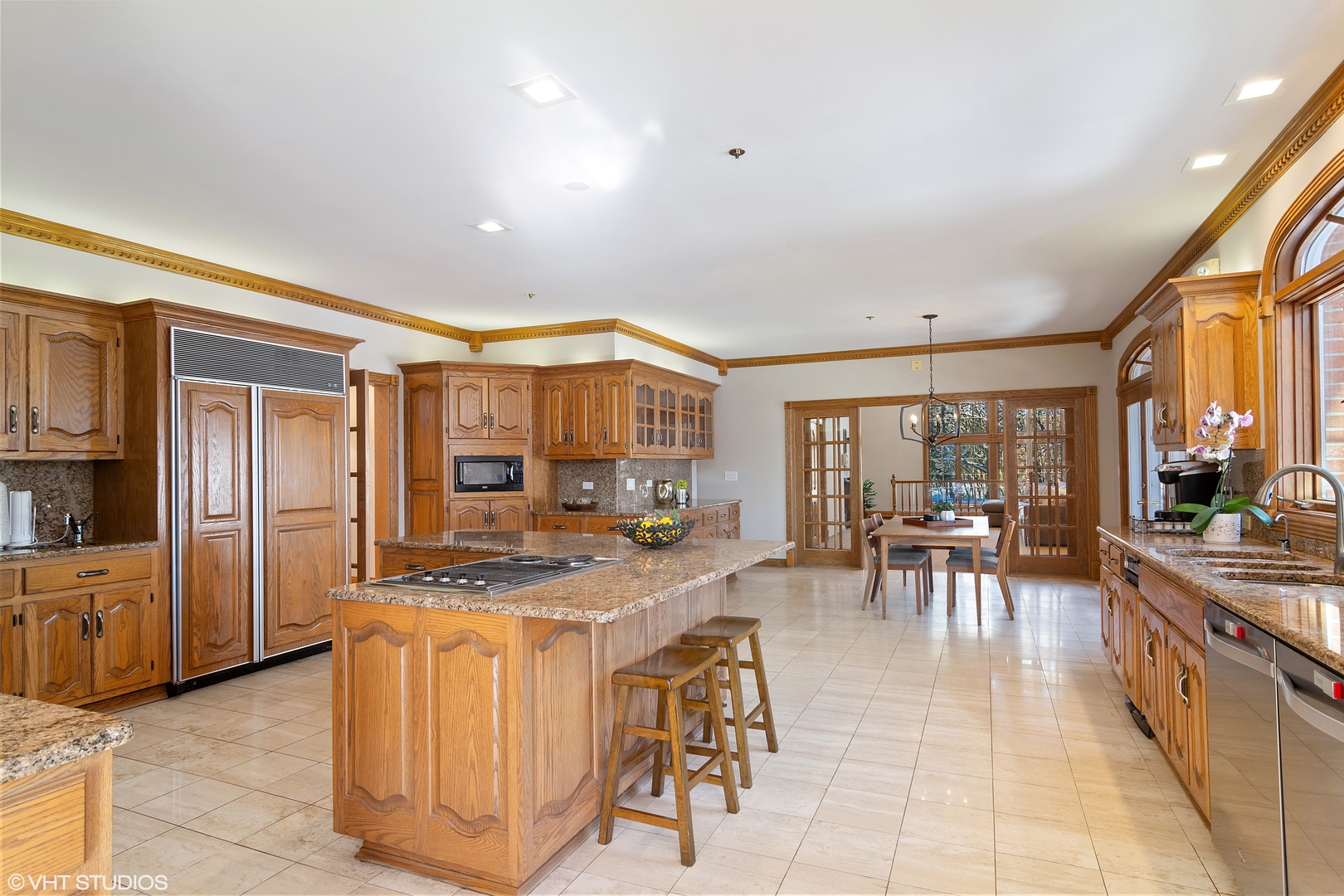 5852 Teal Lane Long Grove, IL 60047 - Photo 4 of 21 a large white kitchen with lots of counter top space a sink a stove and cabinets