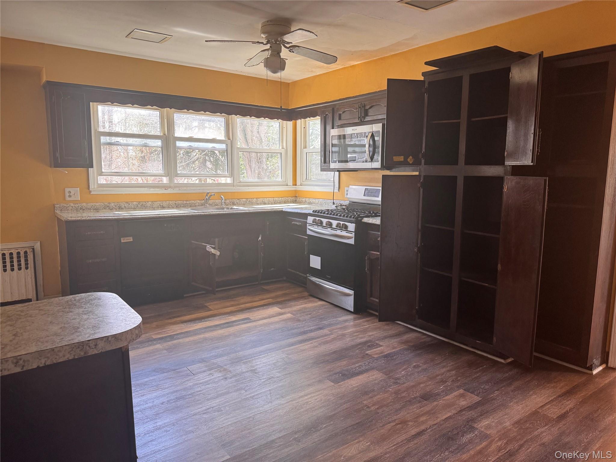 116 Williams Avenue, Unit 101 Spring Valley, NY 10977 - Photo 12 of 23 a room with a window and wooden floor