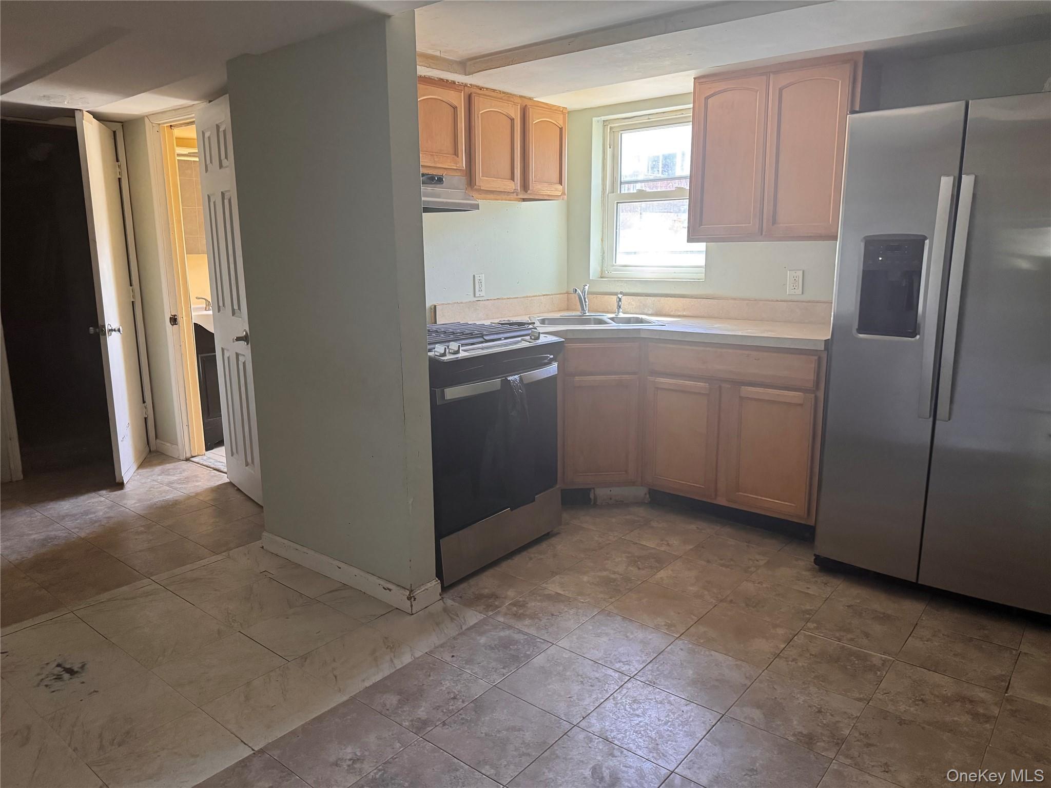116 Williams Avenue, Unit 101 Spring Valley, NY 10977 - Photo 19 of 23 a kitchen with stainless steel appliances granite countertop a refrigerator and a sink