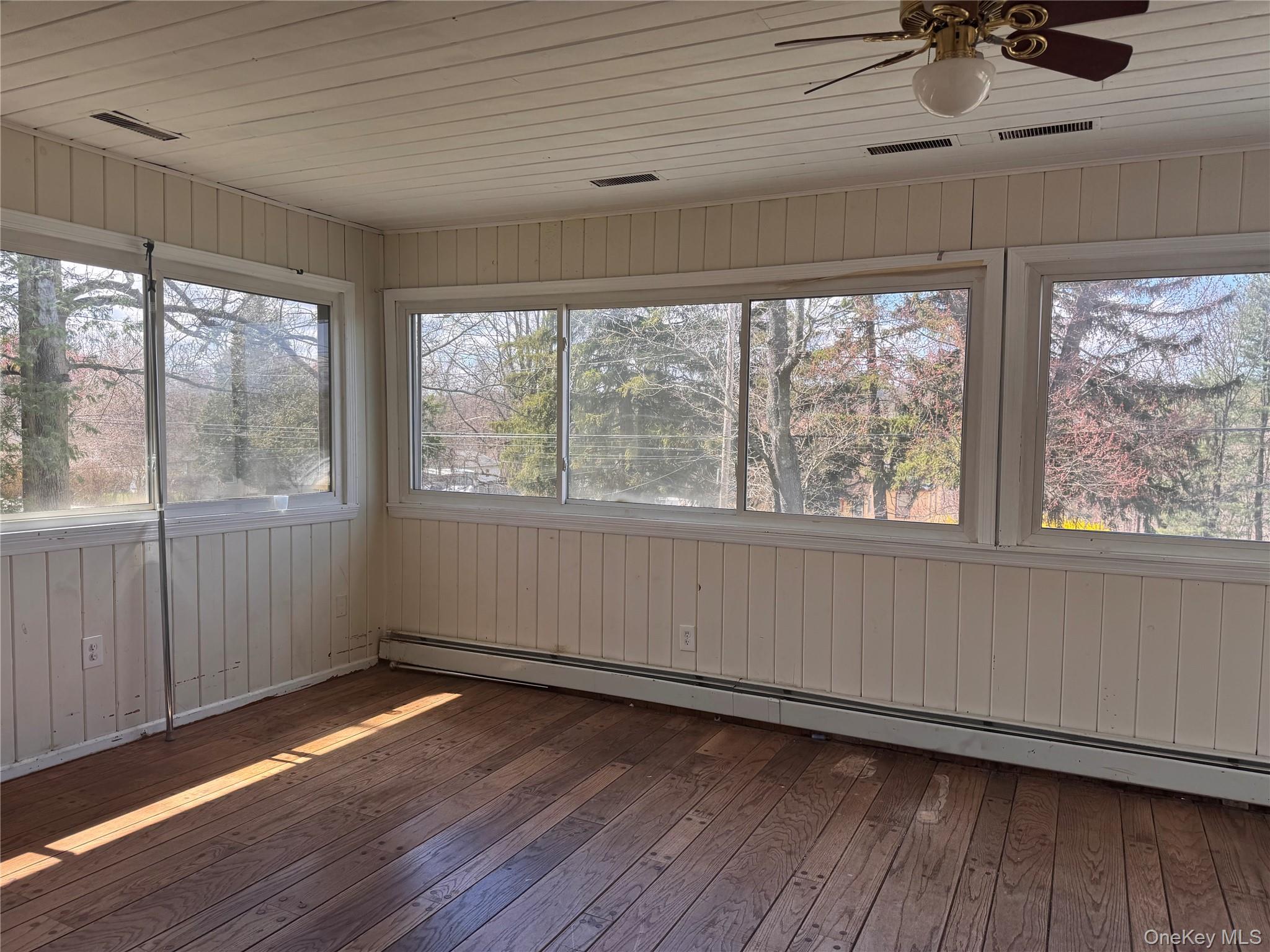 116 Williams Avenue, Unit 101 Spring Valley, NY 10977 - Photo 6 of 23 wooden floor in an empty room with a window