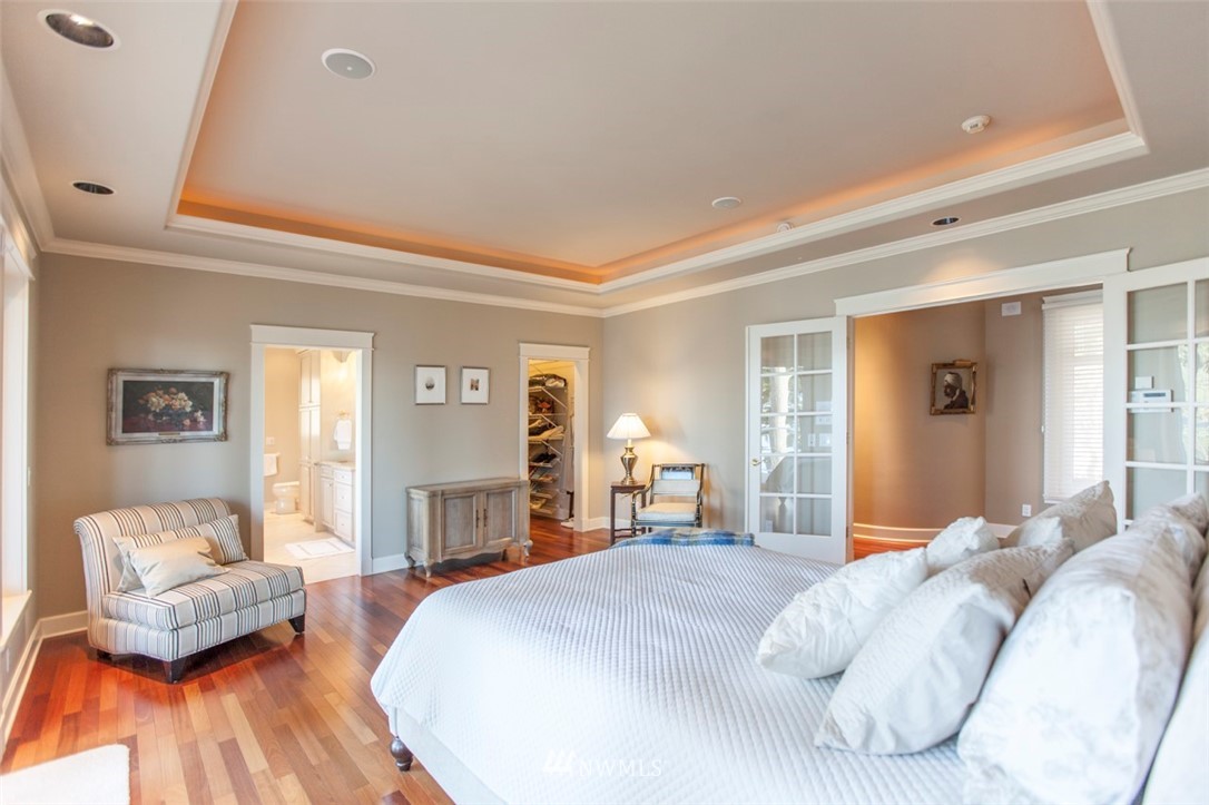 732 Fieldston Road Bellingham, WA 98225 - Photo 12 of 25 a bedroom with a bed and wooden floor