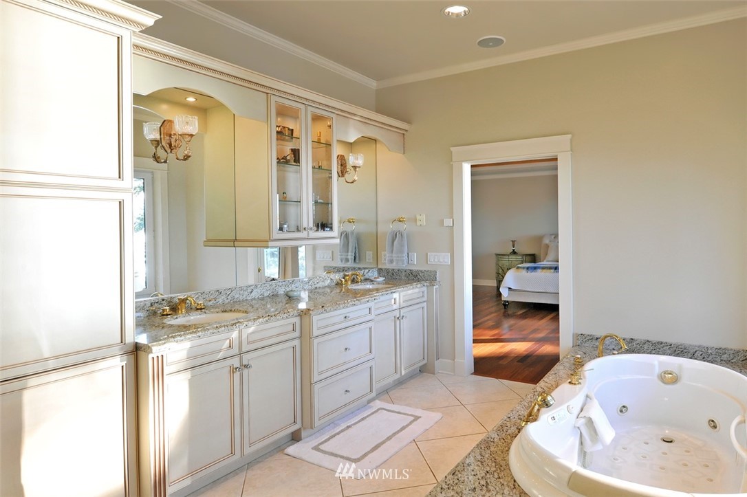 732 Fieldston Road Bellingham, WA 98225 - Photo 15 of 25 a spacious bathroom with a tub sink and mirror